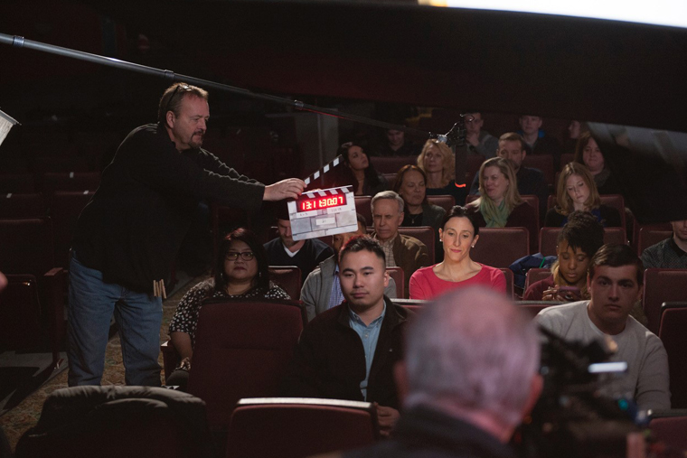 Eileen Little as Lisa sitting in audience